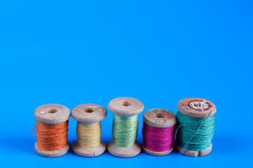 Old wooden reels of thread