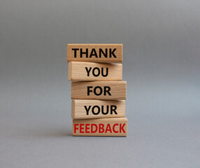Feedback symbol. Wooden blocks with words Thank you for your Feedback. Beautiful grey background. Business and Thank you for your Feedback concept. Copy space.