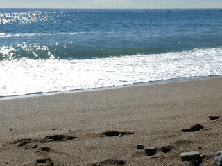 Waves breaking on the sand
