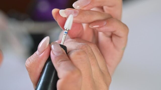 Close up woman doing manicure