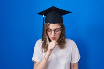 Blonde caucasian woman wearing graduation cap feeling unwell and coughing as symptom for cold or bronchitis. health care concept.