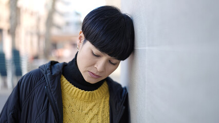 Obraz premium Young chinese woman standing with serious expression at street