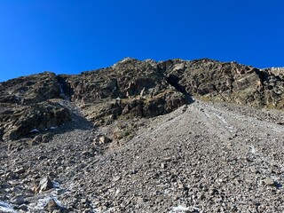 Rocks and stones in the autumn Alpine environment of the Albula Alps and above the Swiss mountain road pass Fluela (Flüelapass), Zernez - Canton of Grisons, Switzerland (Schweiz)