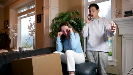 teen boy and teenage girl twins brother and sister received big box delivery girl crying she doesn't like it boy calling swearing waving dark room problem solving slightly feigned situation sportswear