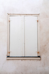 Windows with wooden shutters