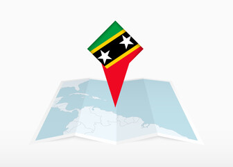 Saint Kitts and Nevis is depicted on a folded paper map and pinned location marker with flag of Saint Kitts and Nevis.