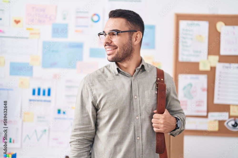 Sticker young hispanic man business worker smiling confident holding briefcase at office