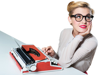 Attractive young woman working on vintage typewriter on white background