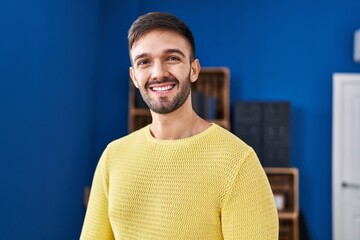 Young hispanic man smiling confident standing at home
