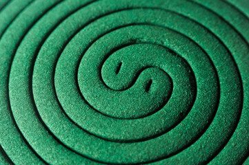 Fototapeta na wymiar circular green mosquito coil can be used as a background