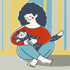 A woman with a cat in her arms.