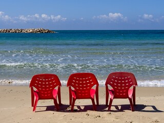 Chairs and lounges at the spectacular sandy beach of Netanya, Israel. Mediterranean coast on a sunny day