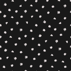 Fototapeta na wymiar Vector illustration. Seamless pattern of white flowers on a black background. Printing on textiles, for packaging, product design.