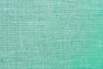 Green canvas texture with real linen threads on canvas with beautiful linen texture on canvas as sample of green linen canvas