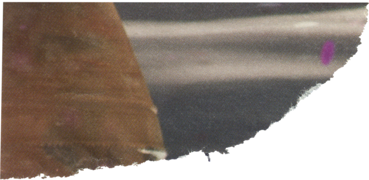 gray textured scrap of magazine paper