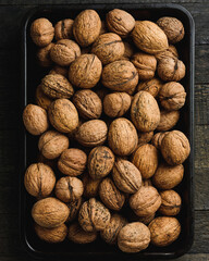 Walnuts in a baking tray.