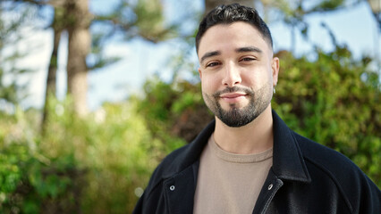 Young arab man smiling confident standing at park