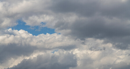 Beautiful huge fluffy clouds on the blue sky. Sky clouds background.