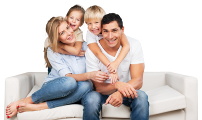 Beautiful smiling family sitting at sofa at home