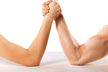 A man and woman with hands clasped arm wrestling Isolated