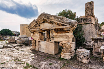 Fototapeta premium Scenic ruins of the Corinthian order East Triumphal Arch at the ancient the Sanctuary of Demeter in Eleusis, Attica Greece