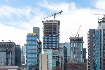 Fototapeta na wymiar Highrise construction transforms the city skyline amid an ongoing condominium boom in Toronto
