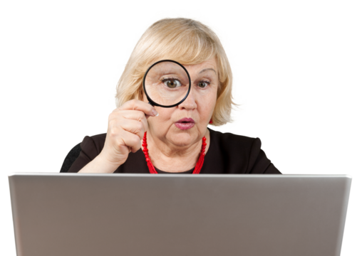 Shocked Old Woman Looking Through Loupe and Using Laptop - Isolated