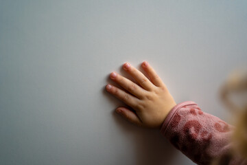 toddlers hand on a wall