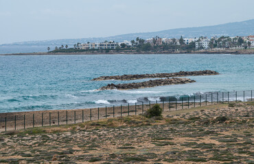 Obraz premium Coastal view over the archaelogical site of the Tombs of the Kings, Paphos, Cyprus