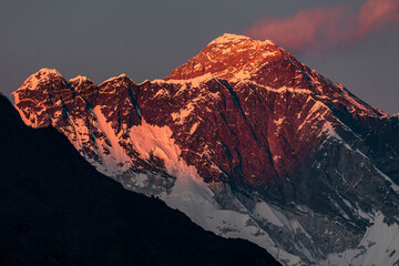 Pink sunset at Mount Everest and Nuptse with marshmallow cloud over  Everest 