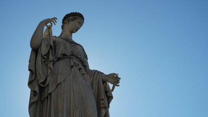 Statue of the Allegory of Spring in backlight, in Piazza del Popolo in Rome