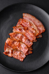 Delicious fresh fried bacon stripes with spices