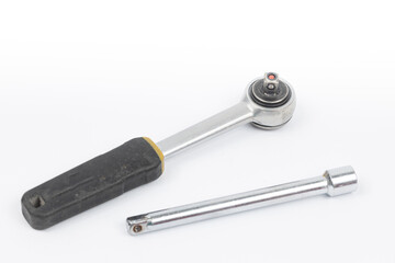 Close-up ratchet wrench. Professional tool. Isolated on a black background.