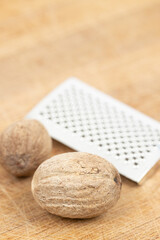 Nutmeg isolated. Whole nut and nutmeg powder isolated on white background.