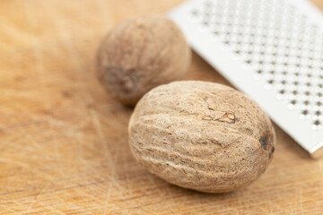 Nutmeg isolated. Whole nut and nutmeg powder isolated on white background.