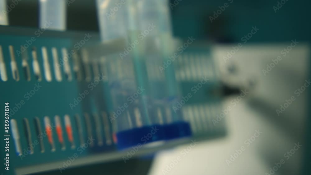 Poster expertise. stock footage. test tubes with analyses rotating around on a special device.
