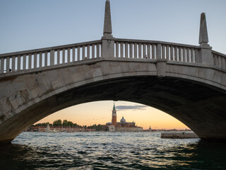 San Giorgio Maggiore island seen under a bridge at sunset, Venice
