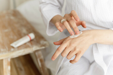 Obraz na płótnie Canvas healthy body care concept. ecological cream applied on the hands. dermatology.