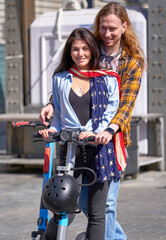 Obraz premium Young couple on the scooter