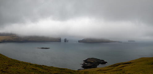 Gáshólmur islet and Tindhólmur cut by low clouds