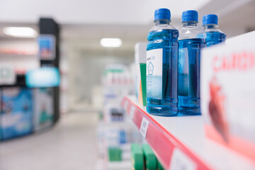 Pharmacy shelves filled with packages of pills and modern medicine, containers of medicaments and supplements. Empty health care shop with drugs bottles and pharmaceutical products.