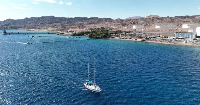 Aerial footage of a boat sailing in the Red Sea in Eilat. Filmed in C4K Apple ProRes 422 HQ