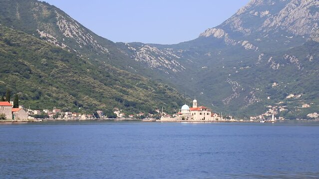 Montenegro, Kotor Bay. Beautiful church on island, Madonna on reef, near city Perast in Montenegro. summer, spring, Crna Gora