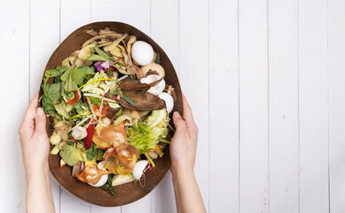 Organic garbage for compost on a wooden background. Composting concept flat lay, top view