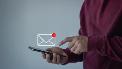 Email marketing and newsletter. Male hand use smartphone with 1 new email alert sign icon pop up....