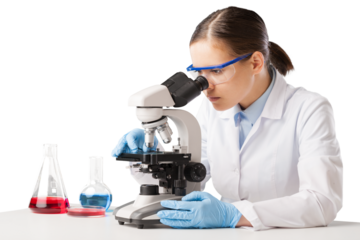 Young scientist looking through a microscope in the laboratory.