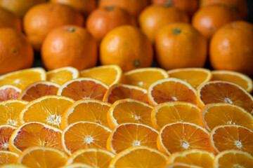 Close-ups of whole oranges and sliced citrus fruits