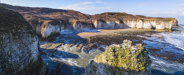 Beautiful sunshine shining over Flamborough Head white chalk cliffs. Panoramic view. Touristic destination concept. High quality photo