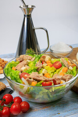Close-up of an Salad in a glass bool with its ingredients around 