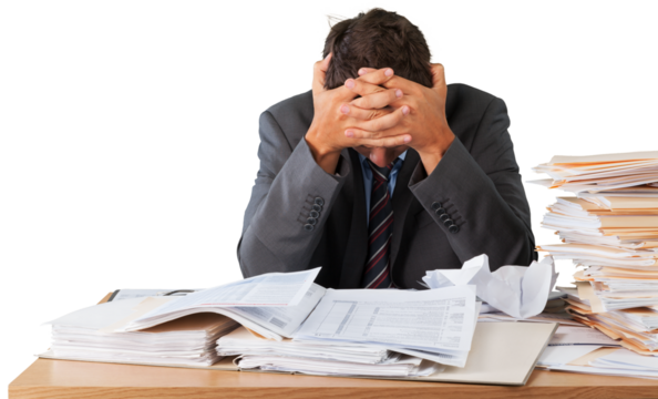 Businessman near heap of papers on background